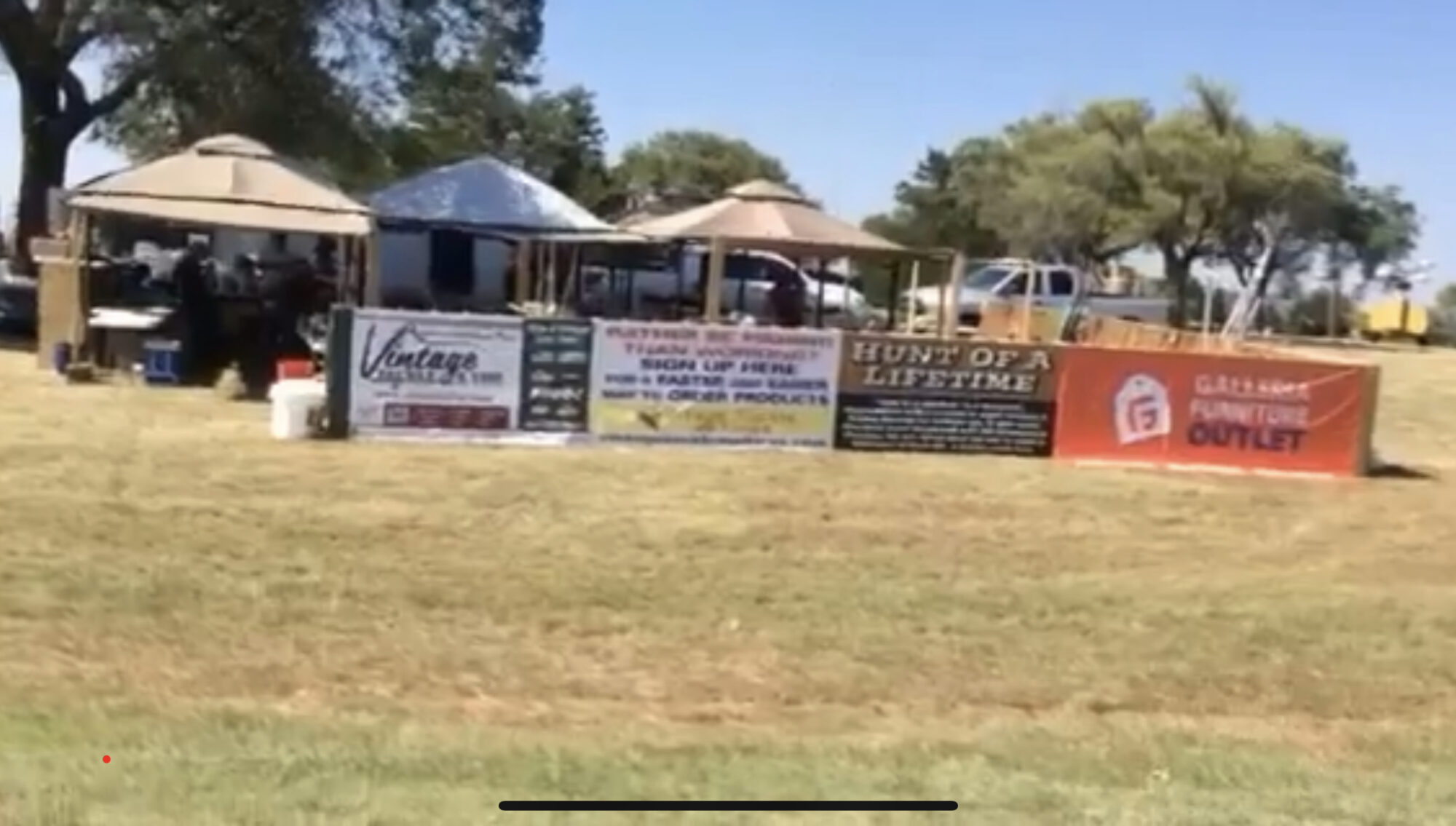 Sponsors banners at Foss Lake Christmas in July event