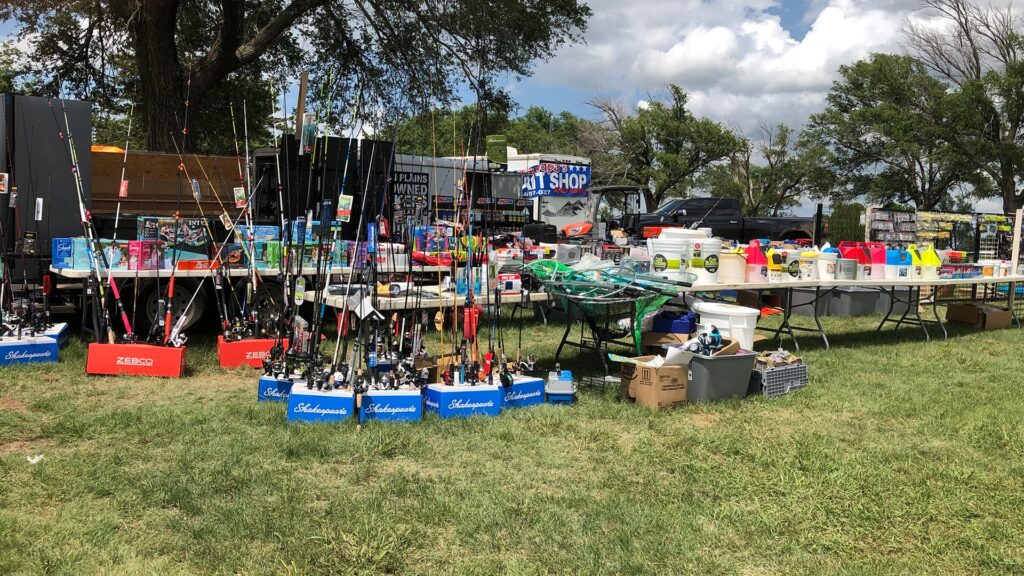 A well-stocked fishing gear vendor booth at Foss Lake Christmas in July event