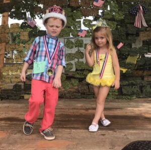 Chase and Amy Ebersole, brother and sister, crowned King and Queen in the Christmas in July Pageant in 2017 in the 3-6 year old division.